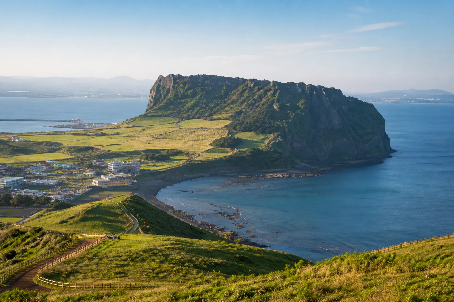 Seongsan Ilchulbong rising above Jeju's volcanic coast