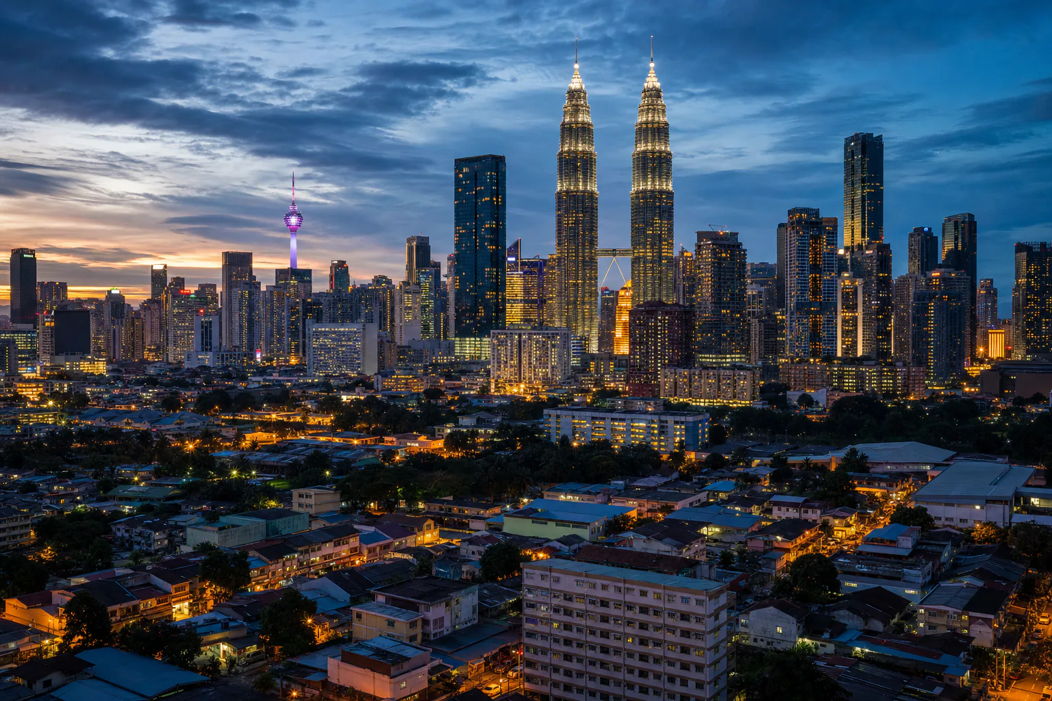 Petronas Towers above the Kuala Lumpur skyline at dusk