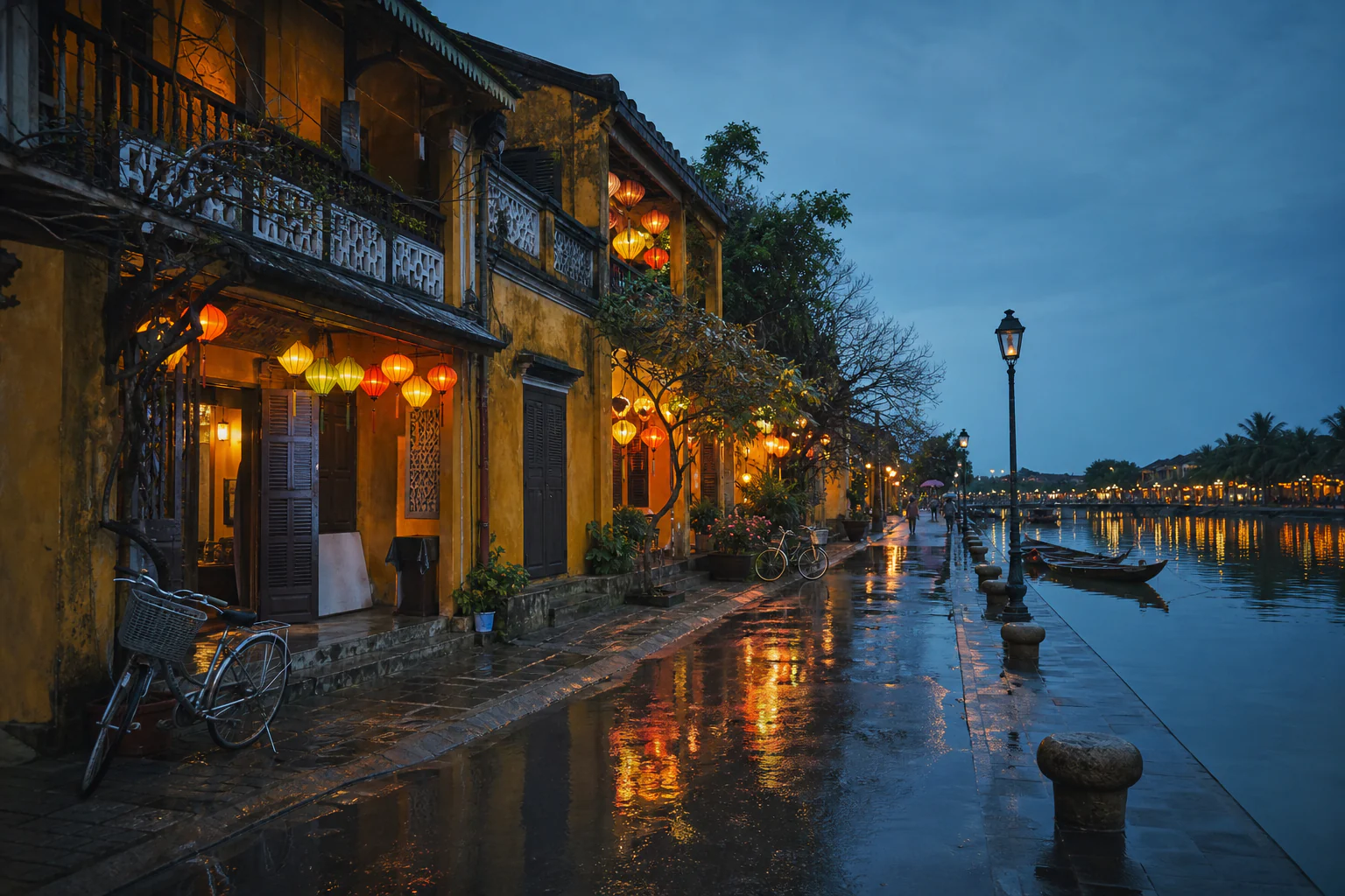 Lantern-lit yellow heritage buildings beside the river in Hoi An