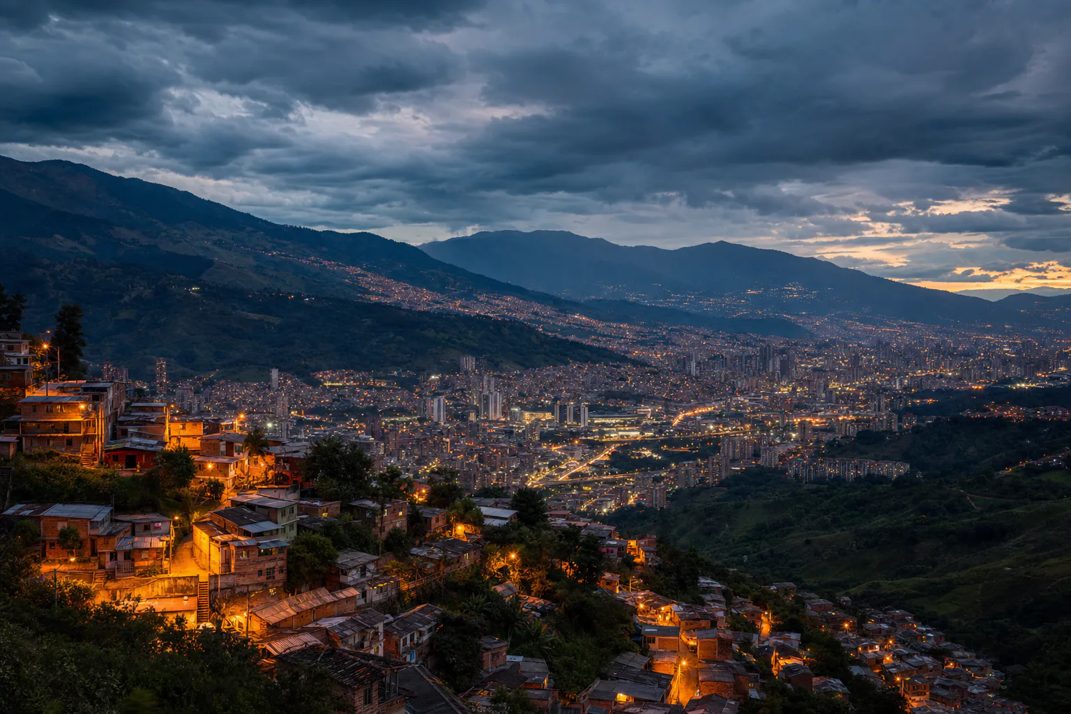Medellín valley at dusk with lights climbing the hillsides