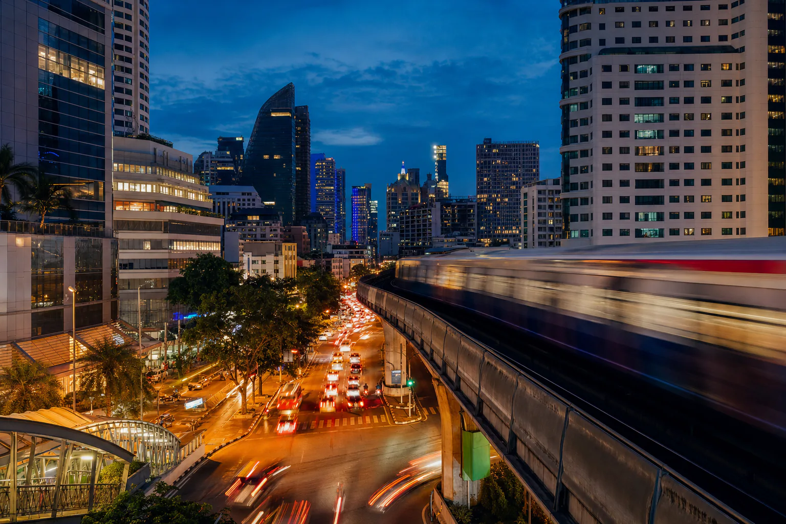 Skytrain crossing above the Sukhumvit road at night